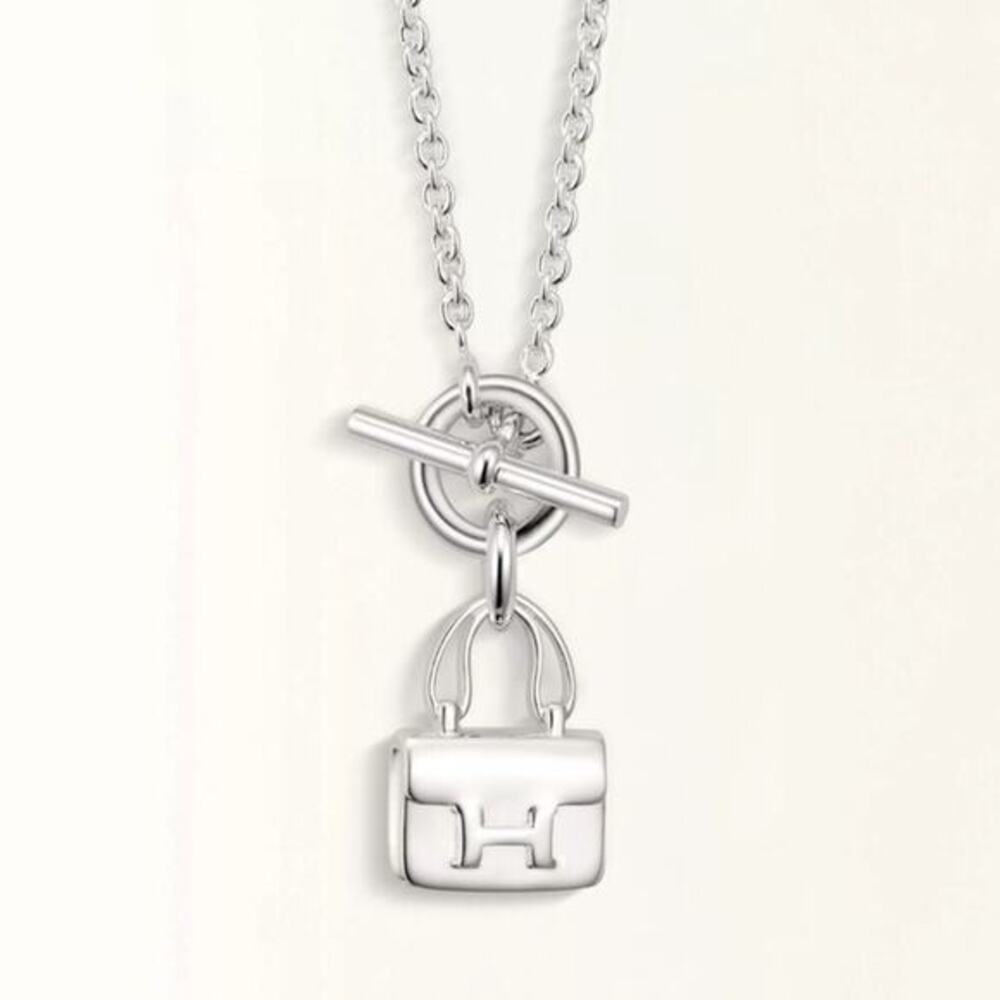 Hermes sterling silver Amulettes Constance necklace pendant